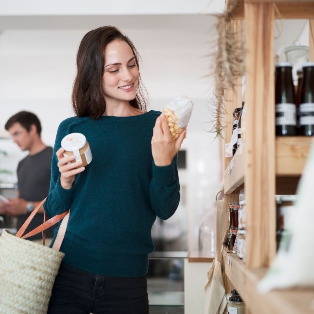 A woman reading a label.