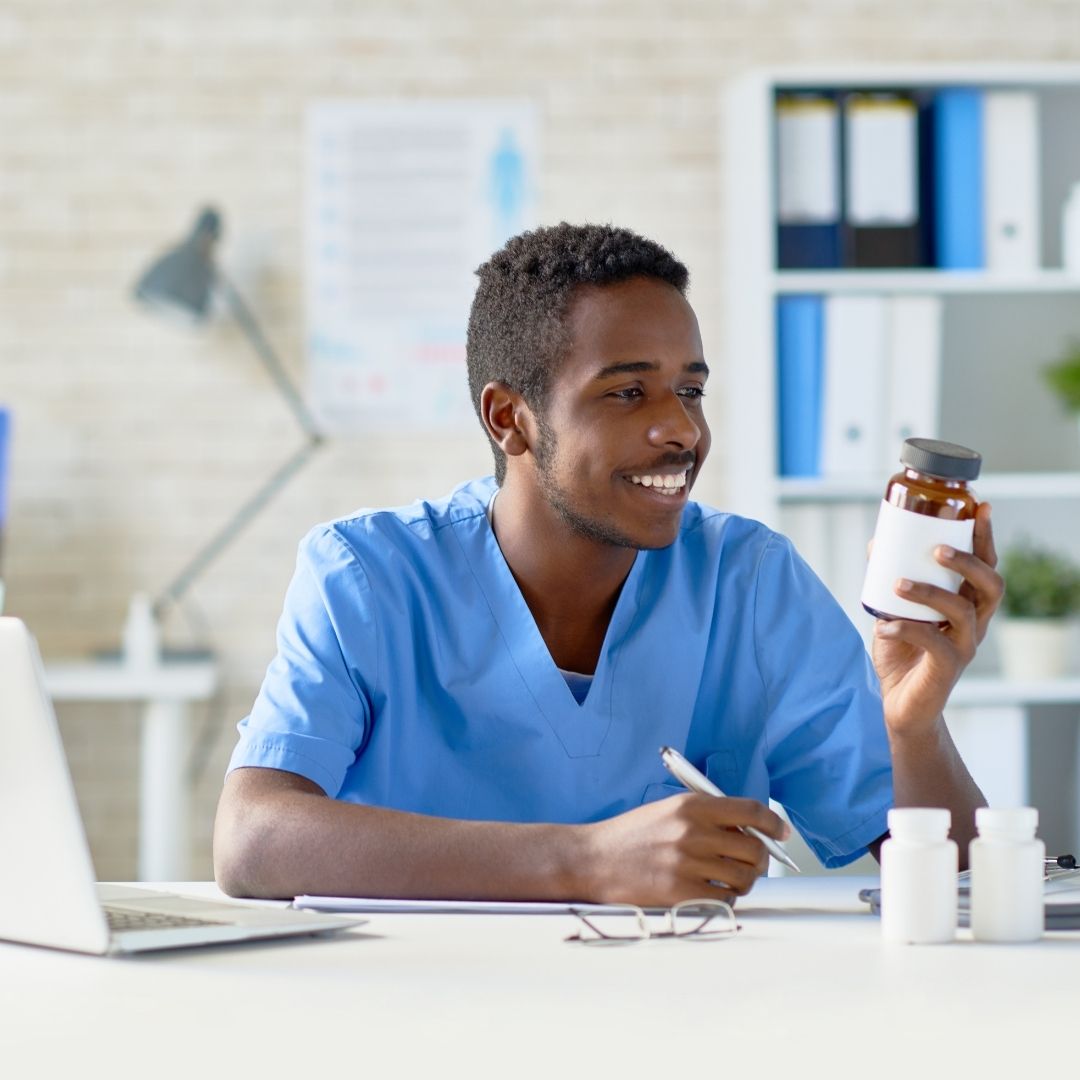 Man looking at medicine bottle