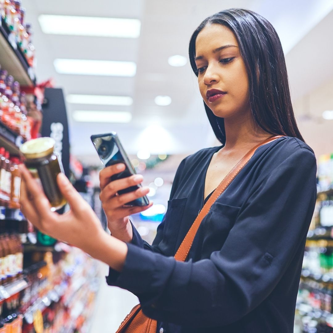 woman looking at product label