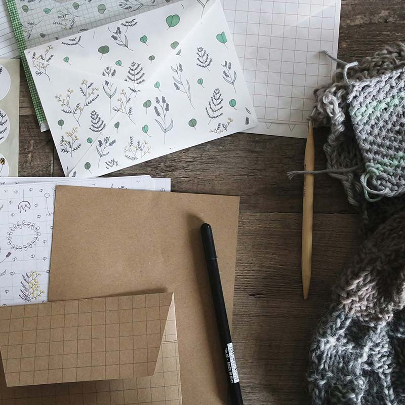 designed envelope, brown paper stationery, grid pattern