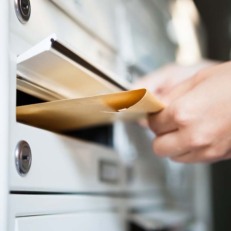 putting envelope in mailbox