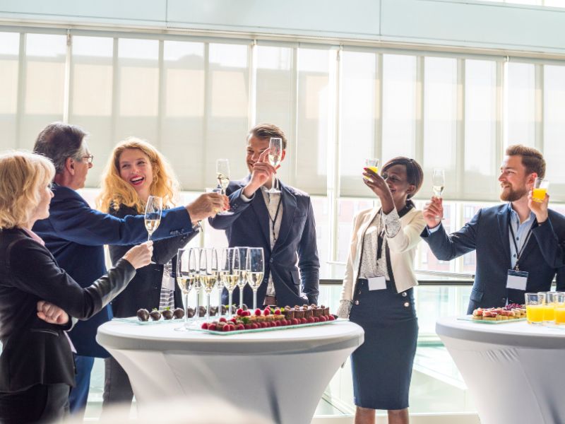 associates raising a glass at a corporate event
