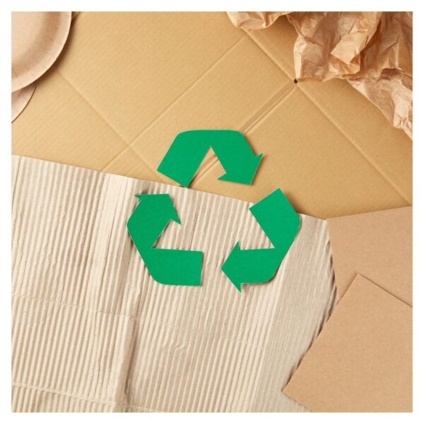 recycling symbol over cardboard