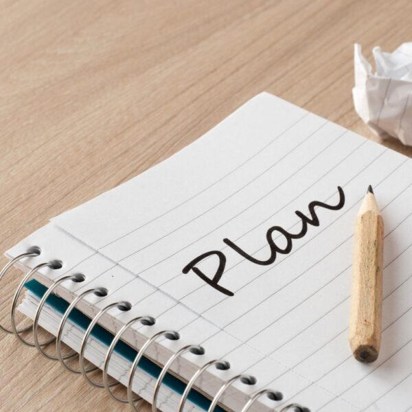 notebook with plan written on it