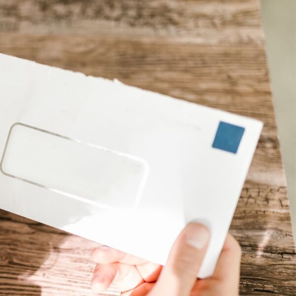 someone holding a piece of mail