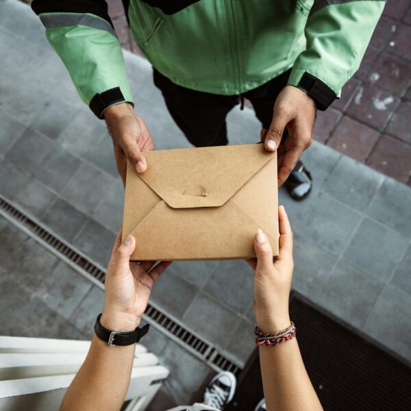 person handing mail to someone