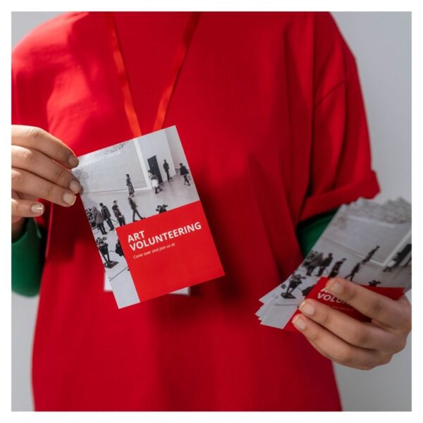 Person holding brochures