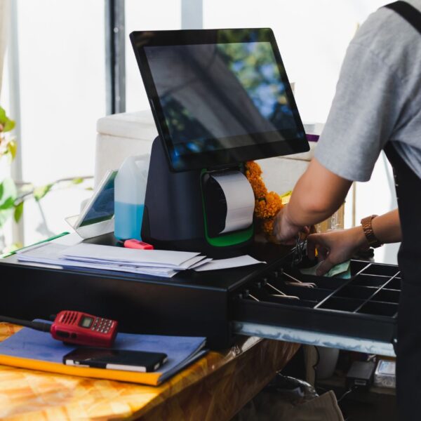 Emloyee at a register.