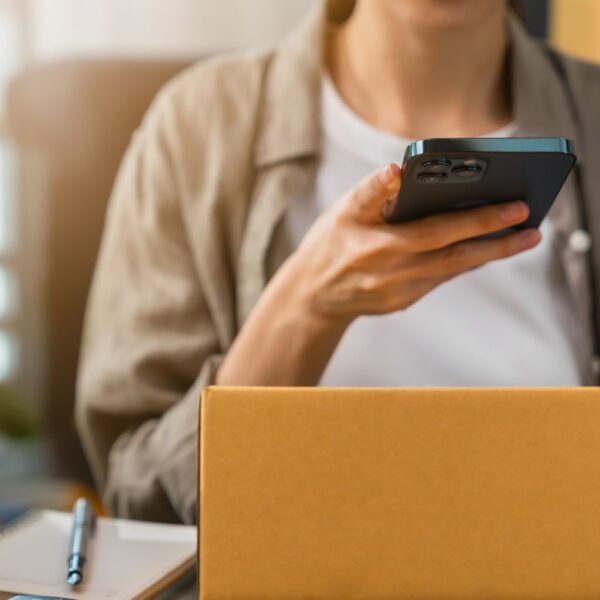 Person scanning a QR code.